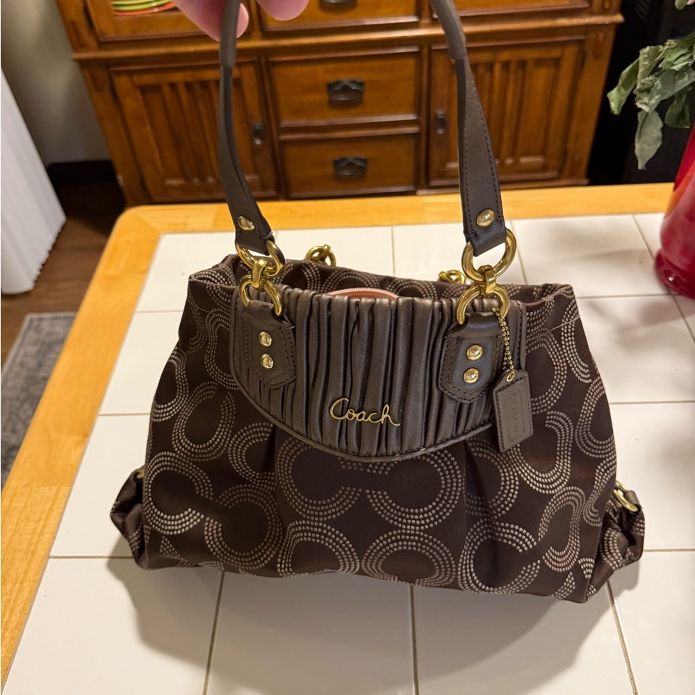 Coach Brown Shoulder Bag with Signature Design with matching wallet